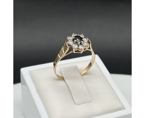 A 9ct yellow gold cz ring,
1.7 grams in weight approx,
size R