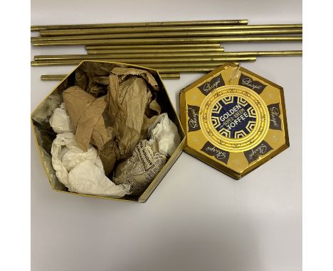 A mixed lot, vintage tin holding, brass casters for furniture, small tilly lamp shades, brass stair rods