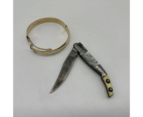 A vintage rolled gold bangle and a decorative pocket knife