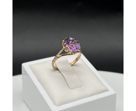 A 9ct yellow gold amethyst stone set ring,
1.8 grams in weight approx,
size J,