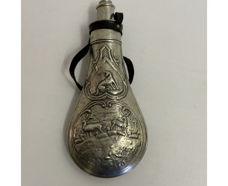 A vintage gun powder flask, with highland stag scenery design