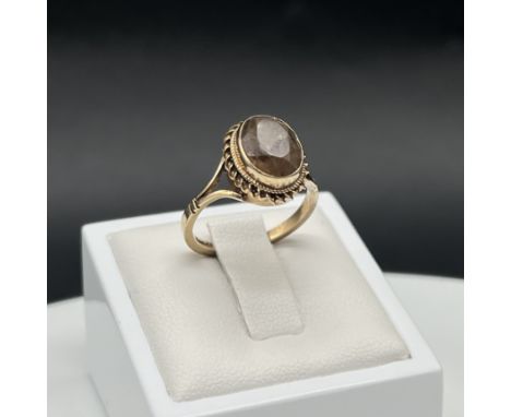 A 9ct yellow gold smokey quartz stone set ring, 3 grams in weight approx, size M