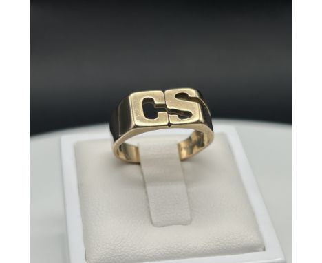 A 9ct yellow gold dress ring,
initial ring with CS,
5 grams in weight approx,
size L 1/2,
ring has some bumps to the shank