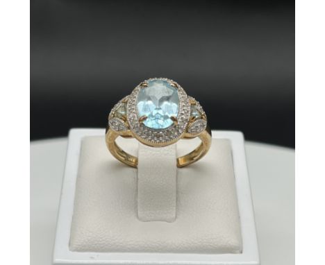 A 9ct yellow gold aquamarine + diamond dress ring,
size P,
approx weight 4.9 grams,
nice thick shank,
in overall good conditi