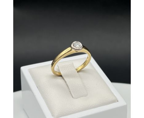 An 18ct yellow gold single solitaire diamond ring, diamond is approx 0.30ct, rub over set stone, weight is 3.4 grams aprox, s