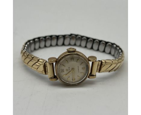 A vintage Cyma 9ct watch, gold case but not a gold strap, mechanical movement, in working order, 16mm dial