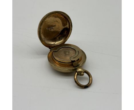 A vintage sovereign coin case, 9ct rolled gold,has a few dents on the outer case