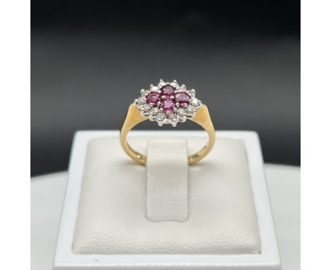 An 18ct yellow gold ruby + diamond dress ring,
all claws + stones are in good condition,
good clean thick shank,
fully hallma