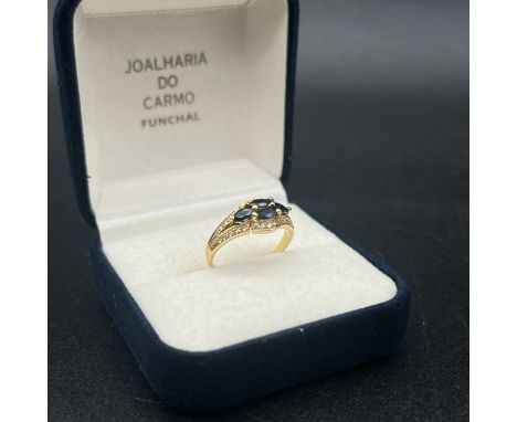 A silver sapphire + diamond + gold plated dress ring, has an 800 stamp hallmark, made by Joal Haria Do Carmo, in original box