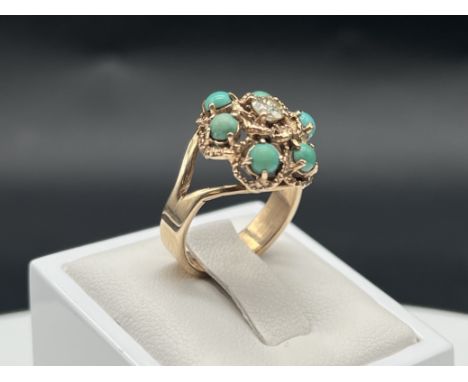 A 9ct yellow gold turquoise + diamond ring,
vintage,
5.3 grams in weight approx,
size N,
nice thick solid shank in lovely con