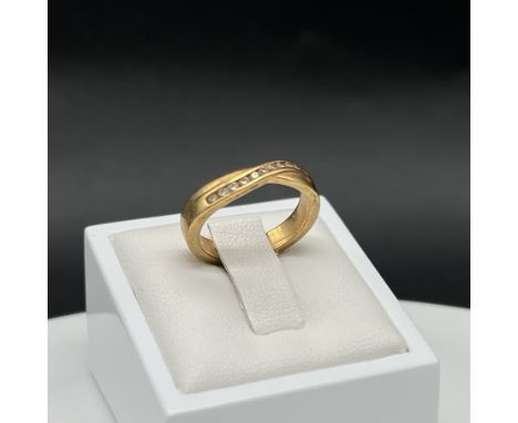 An 18ct yellow gold eternity diamond twist ring, size J 1/2, 0.20ct approx, lovely thick ring, 5.3 grams in weight approx