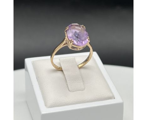 A 9ct yellow gold large amethyst stone set dress ring,
size R,
2.9 grams in weight approx