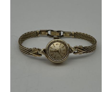 A vintage Omega ladymatic watch, mechanical watch, will require a service, strap is hallmarked USA, gold plated watch, no box