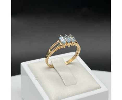 A 9ct yellow gold blue stone dress ring, size U, weight is 2.6 grams approx