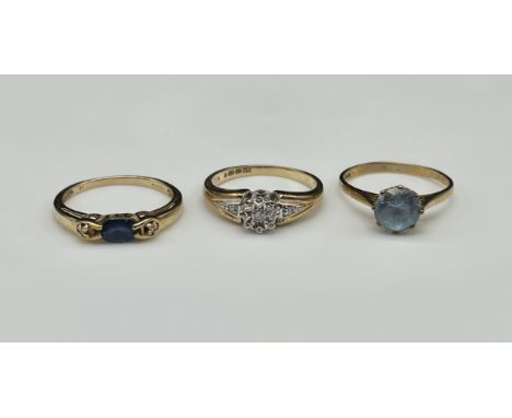 3x 9ct yellow gold dress rings, a diamond solitaire size M, an ovel cut sapphire and diamond ring size N, a singe blue stoned