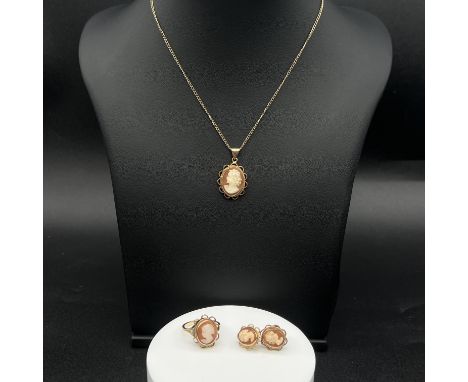 A 9ct yellow gold Cameo jewellery set,
 18 inch chain, 
25mm x 15 mm cameo pendant,
 ring is a size L, 
matching earrings has