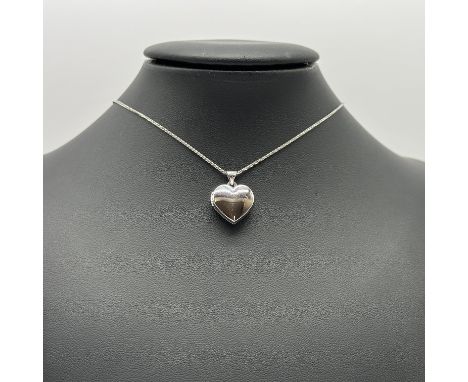 A silver heart locket and chain
on a 16 inch chain
nearly new condition
locket opens well