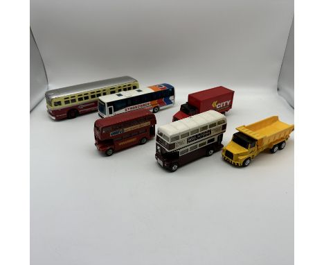 A mixed lot of model buses and lorries