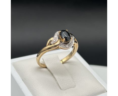 A 9ct yellow gold sapphire + diamond dress ring,
size P,
good all round condition,
2.4 grams in weight approx