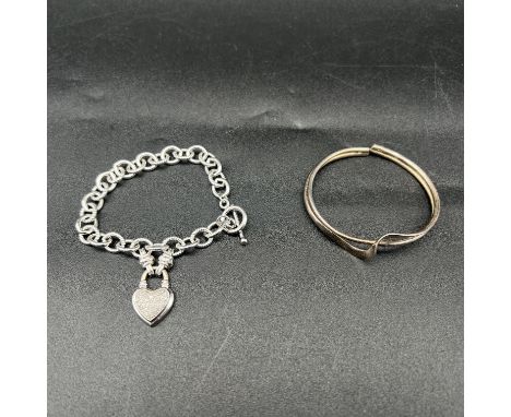 A silver bracelet and silver bangle, bracelet with a heart design, silver bangle, weight is 38 grams total approx