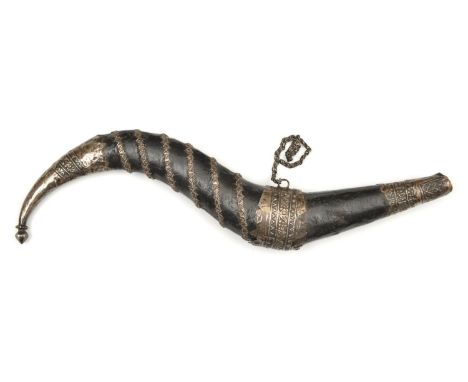 A horn-shaped Indian priming flask. 27cms, fabric covered, swollen in the middle, mounted with pressed silver mounts and spir