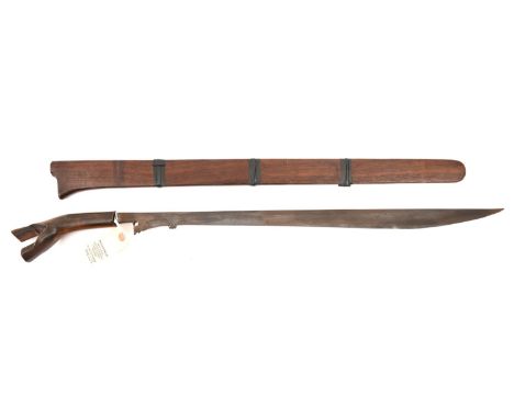 A Klewang, slender SE blade 23", swollen towards point and with simple pierced decoration to inner edge at forte, darkwood se
