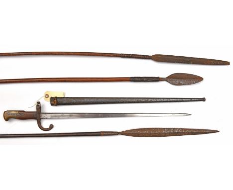 A French Gras bayonet,  d 1876 on backstrap, matching nos to hilt and scabbard (some surface rust); an African spear, with sl