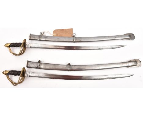 2 Indian cadet swords, each with slightly curved, fullered blade 22½", marked "India" at forte, French style brass hilt, the 