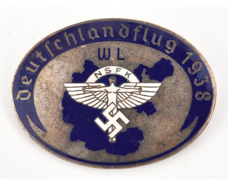 A Third Reich pin back oval silver plated and enamelled badge, in the centre the NSFK symbol in white enamel, and on a blue e