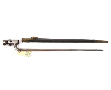 An 1853 Enfield type socket bayonet, deeply impressed Indian marking to blade, locking ring to socket, in brass mounted leath