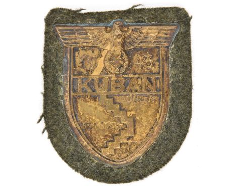 A Third Reich Kuban shield,  on field grey cloth patch with zinc backing plate. GC                      £60-80 