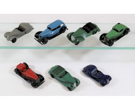 7 Dinky Toys. 36b, Bentley sports car in green. 36e, British Salmson 2-seater sports car in red. 2x 38a, Fraser Nash sports c