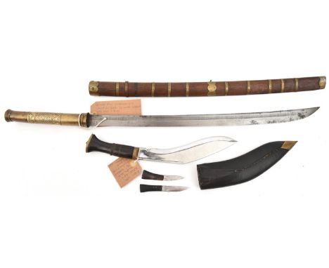 A Burmese shortsword dha, slightly curved, swollen blade 21", with shallow back fuller, sheet brass covered grip, with simple