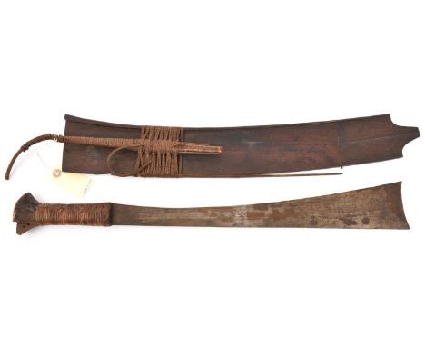 An Indonesian sword parang, SE blade 19", flared to broad concave end, cord bound grip, flared wooden pommel (chipped), in it