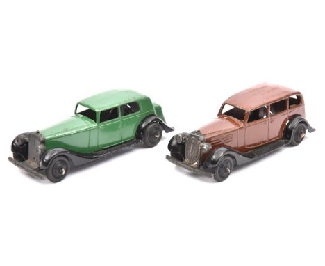 2 Dinky Toys. 30c, Daimler in green. 30d, Vauxhall in brown. Both with ridged black wheels and open baseplates. GC, some wear