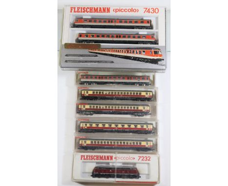 10x N gauge model railway Deutsche Bahn items by Fleischmann. Including a Class 210 diesel locomotive, 210 002-2, in red and 