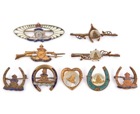 9 R Artillery sweetheart items, each featuring the cannon badge: 4 various enamelled horseshoe badges; 3 tie pins, with leave