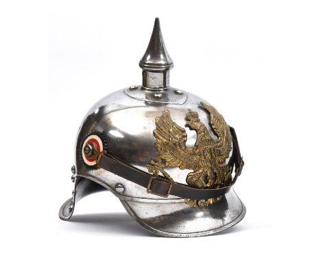 A WWI Prussian Cuirassier's helmet,  of steel with brass line eagle badge, national and state cockades, leather liner and lat