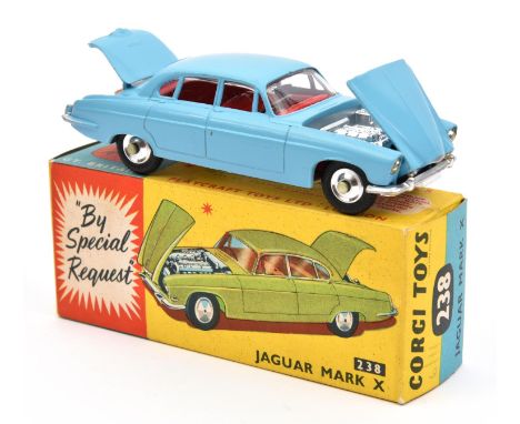 A Corgi Toys Jaguar Mark X (238). With light blue body and red interior. Including suitcase and briefcase. Boxed with model c