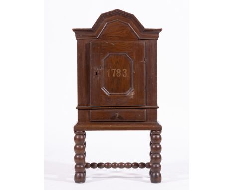 Baltic grained pine dole cupboard, bears date 1783, moulded arched top, recessed panelled door, single drawer under, raised o