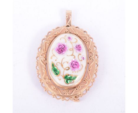 An contemporary oval ceramic brooch/pendant, cream ground decorated with a floral design in pink and green with gilded highli