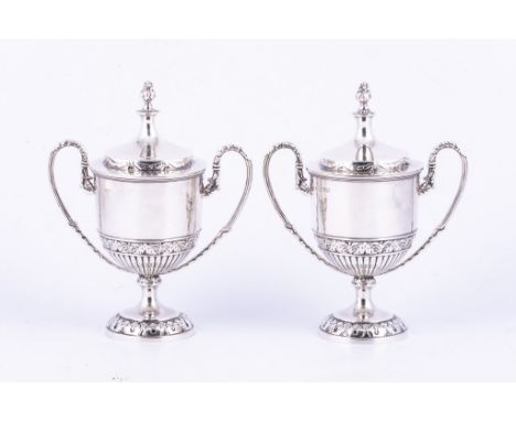 Pair of Edwardian silver urn-shape sugar vases, by Nathan & Hayes, Chester 1909, domed lids with cast finial, each with twin 