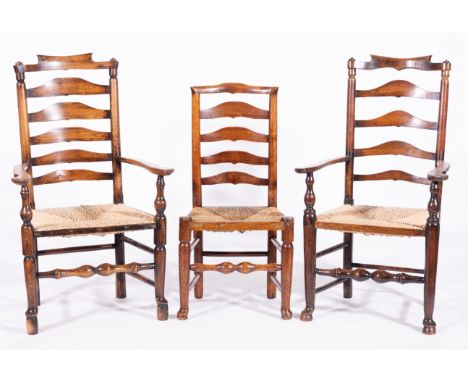 Harlequin set of ten ash ladder-back dining chairs, yoke crestings, graduating splats and rush seats, comprising two elbow ch
