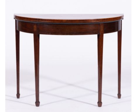 George III mahogany demi lune foldover card table, the top with rosewood banding and stringing, enclosing a baize-lined inter