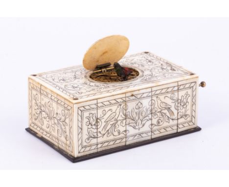 Ivory cased singing bird automaton, French or Swiss, late 19th Century, oblong case with engraved decoration of birds and scr