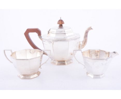 Three-piece silver tea set Adie Bros Limited, Birmingham 1921, polygonal shape, the teapot with composition handle and finial