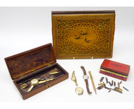 19th century olive wood correspondence folder, the top decorated with marquetry swallows, fret cut surround within a micro-mo