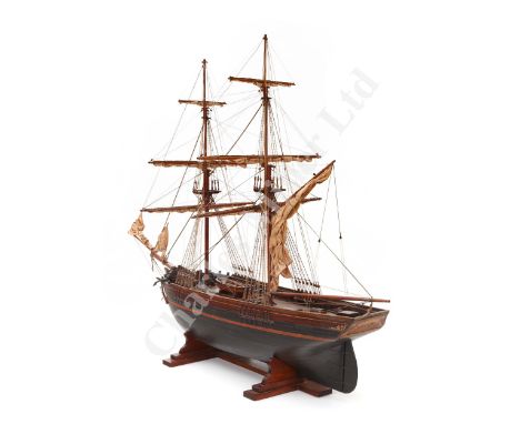 with planked and pinned mahogany hull, finished in dark brown to the chain plates with red boot top, gold filigree decoration