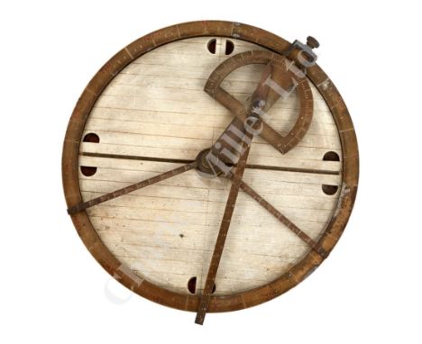 unsigned but probably by Elliott Brothers, painted wooden plate on axis with calibrated brass arms and compass ring to edge –
