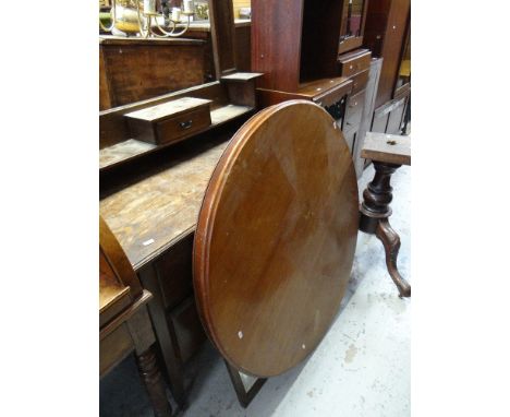 A VINTAGE OAK MIRRORED DRESSING TABLE with shelf and drawer back, together with a  vintage circular tilt top table